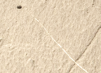 Марсоход прислал фотографию передвигающегося камня