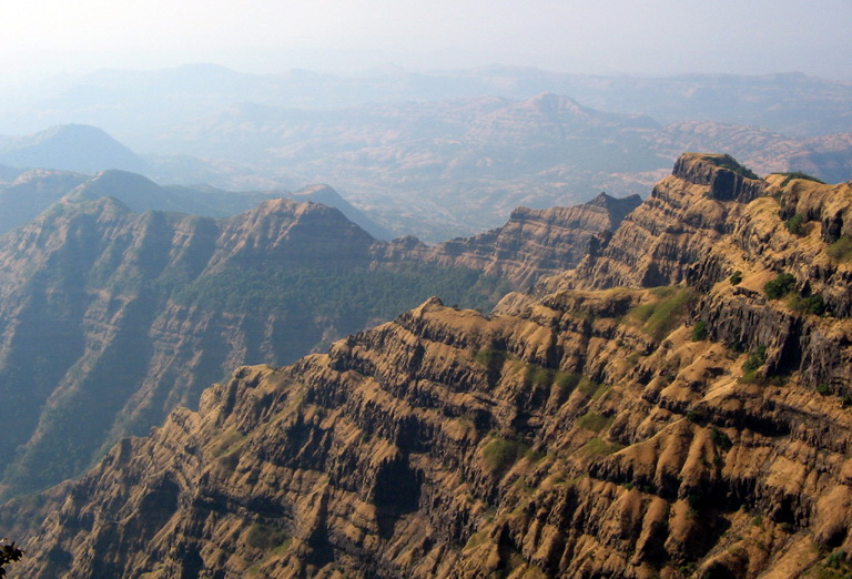 Ground view of mountains sculpted out of the Deccan Plateau